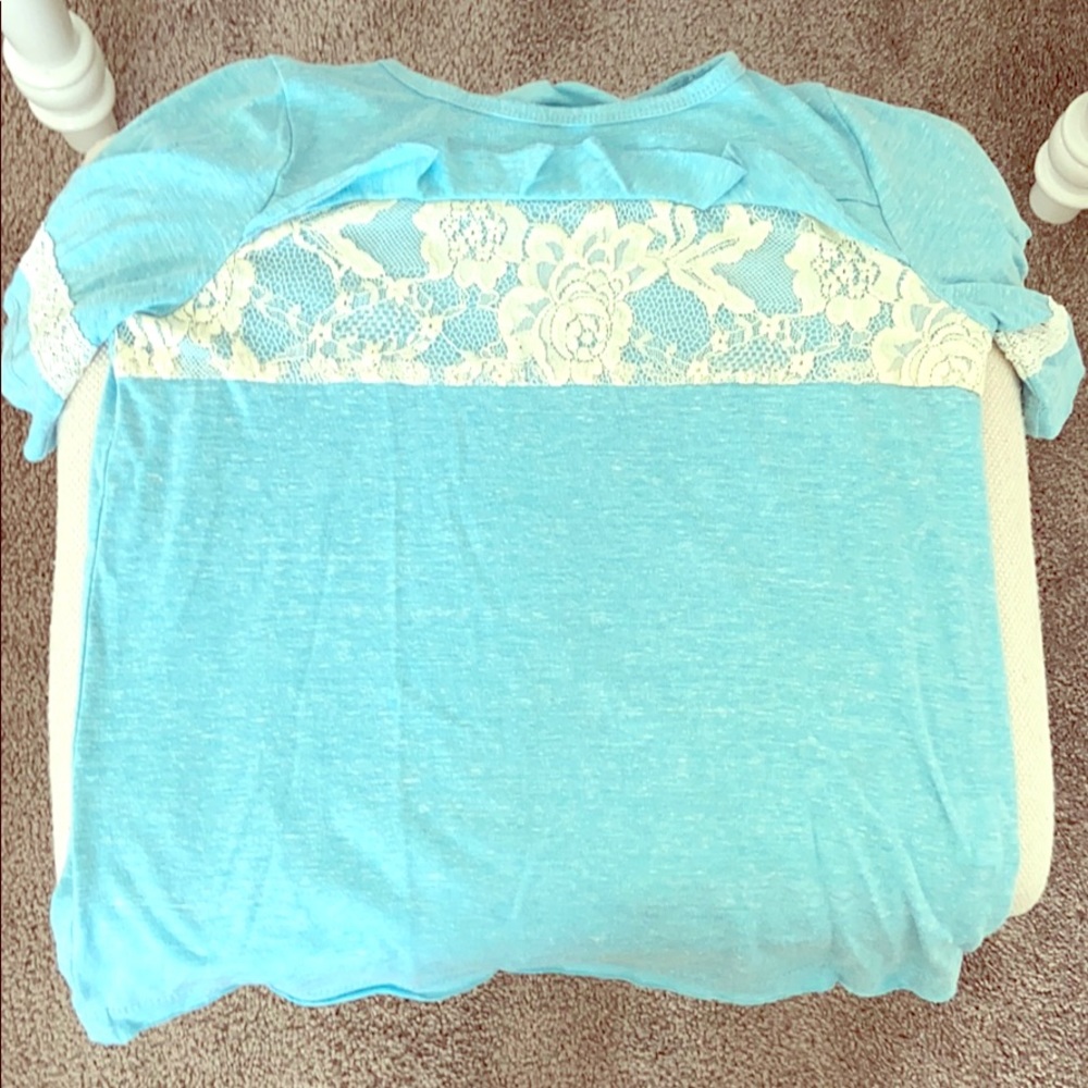 Blue shirt with fabric flower design